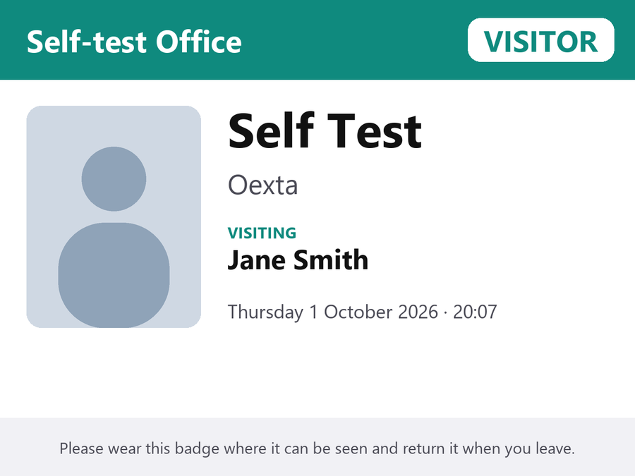 A printed visitor badge with photo, name, company, host and time